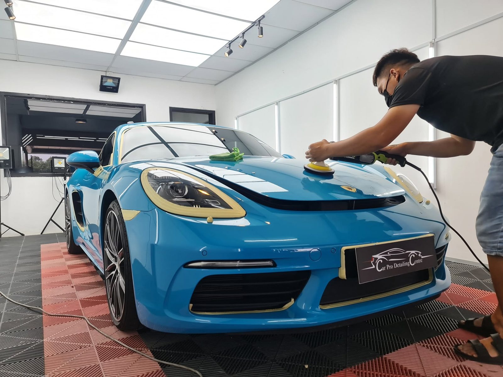 Porsche being polished at Car Pro Detailing Centre